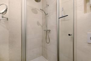 a shower with a glass door in a bathroom at Alte Stadtvilla am Weinberg 1 in Traben-Trarbach +23 photos