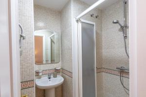 a bathroom with a sink and a shower at A222 El Recreo in Torrox +34 photos