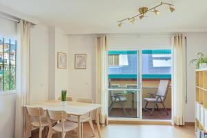 a dining room with a table and chairs at A222 El Recreo in Torrox