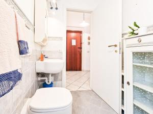 a bathroom with a toilet and a sink at Bilo Le Lecce 15b in Capoliveri