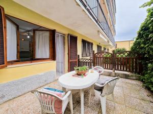 a white table and chairs on a balcony at Bilo Le Lecce 15b in Capoliveri