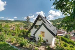 a white house with a black roof at Haus Schwarzwald Königin in Bühlertal