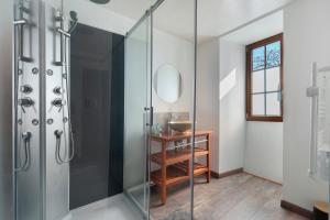 a bathroom with a glass shower with a sink at Chambres d'hôtes Le Plessis in Frossay +42 photos