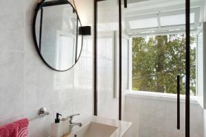 a bathroom with a sink and a mirror at Carros De Cesto Do Monte in Funchal +21 photos