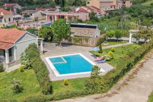an aerial view of a house with a swimming pool at Mini Country House in Sidari