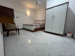 a room with a bed and a cabinet in it at Luxe Mini-Suite Maharagama in Maharagama