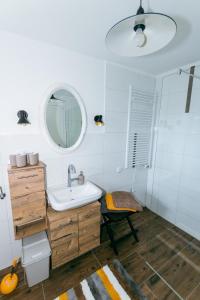 a bathroom with a sink and a mirror at Connyhaus St Oswald ob Eibiswald in Sankt Oswald ob Eibiswald +11 photos