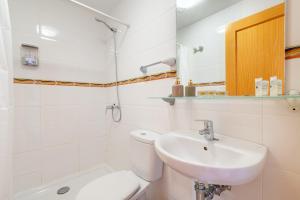 a white bathroom with a sink and a toilet at Ferrera Soul 2b in Felanitx +17 photos