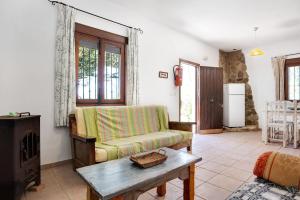 a living room with a couch and a table at Casa Mora - Vejer, El Palmar in Vejer de la Frontera +19 photos