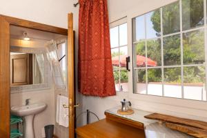 a bathroom with a sink and a window at Agriturismo Il Badalo in Riparbella +85 photos
