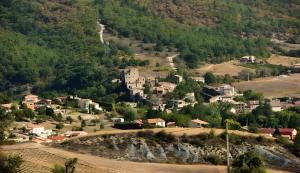 an aerial view of a small village in the mountains at Camping Sainte-Jalle in Sainte-Jalle