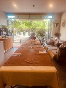 a long table with wine glasses on top of it at Albert Park Haven in Melbourne