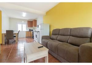a living room with a couch and a table at El Trabaz in Candamin