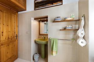 a bathroom with a green sink and a mirror at Al Pinone in Crevoladossola +30 photos