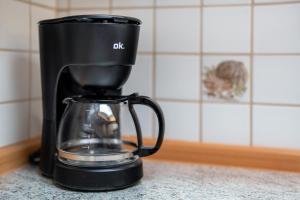 a black coffee maker sitting on a counter at Fewo Naturliebe - keine Monteure in Dornhan