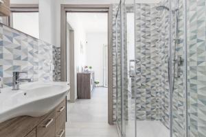 a bathroom with a sink and a shower at Villa Mare Blu in Palermo