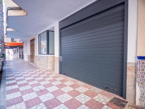 a garage door on the side of a building at 'Mi Esperanza' in Almuñécar