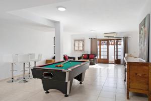 a living room with a pool table in it at Villa Jeamir I in Playa Blanca