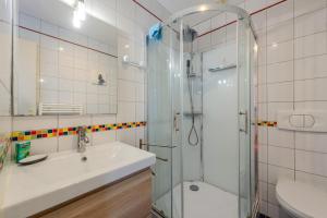 a bathroom with a sink and a shower at Maison de caractère à Roscoff in Roscoff +16 photos
