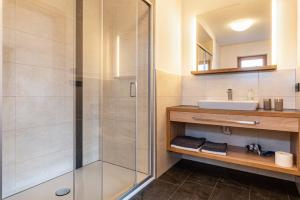 a bathroom with a shower and a sink at Hatzes App Schlern in Laion +22 photos