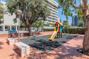 a playground in a park with a slide at Boliche in Benimagrell
