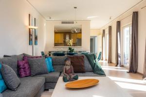 a living room with a couch and a table at Villa Amarador in Santanyi