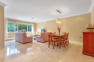 a living room with a table and chairs at Villa Teide in La Orotava