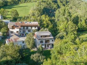 an aerial view of a house in a forest at Appartement la Cascade in Allos