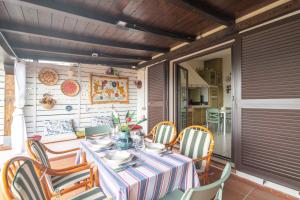 a table and chairs on a patio at Rosemary House in Olbia