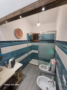 a bathroom with two toilets and a shower and a sink at Rosemary House in Olbia +11 photos