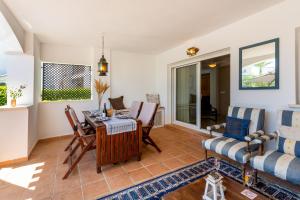 a living room with a table and chairs at Luxury Pool and Spa - Casa Coco in Casas del Cura