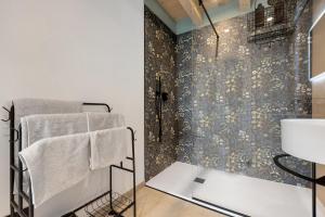 a bathroom with a shower and a sink at Casa Meg in Tremosine Sul Garda