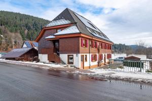 a large building on the side of a street at Haus an der Breg in Vöhrenbach