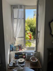 a window in a room with a table in front of it at Keranroux 315 - Île de Bréhat in Bréhat
