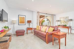 a living room with a couch and a table at Casa Alba in Salobreña