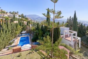 an aerial view of a villa with a swimming pool and trees at Casa Alba in Salobreña