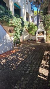 a shadow of a building with a plant on it at Villa Su 3 Piani Con Giardino in Lido di Spina