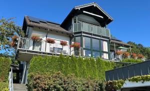a house with balconies on the side of it at Ferienwohnung Moos-Hochsauerland in Olsberg