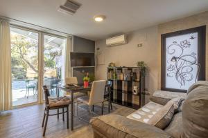 a living room with a couch and a table at San Jose in Nerja