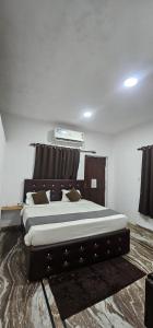 a bedroom with a large bed in a room at Hotel blue ocean baga beach away in Arpora