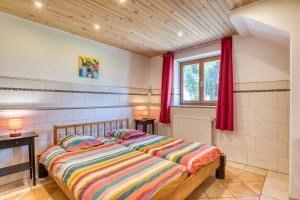 a bedroom with a bed and red curtains at Maison Orange in Aspiran +24 photos