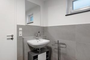 a bathroom with a sink and a window at Casa Simona in Orsingen-Nenzingen +11 photos