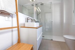 a bathroom with a sink and a shower at Maison Menorca in Arenal d'en Castell +19 photos