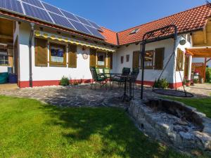 a house with solar panels on the roof at Ferienwohnung Heimatgefühl Thalheim in Leibertingen