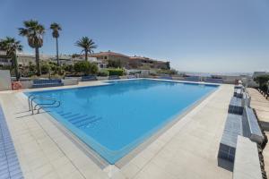 a large swimming pool on top of a resort at Casa Agua Y Sol I in Poris de Abona