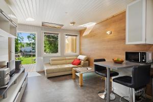 a living room with a couch and a table at Ferienhaus 202 in Zadelsdorf