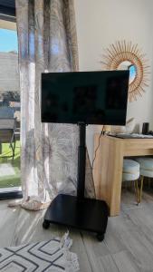 a computer monitor sitting on a desk in a room at Casa Neptune in Sausset-les-Pins