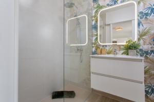 a bathroom with a shower and a sink and a mirror at Neral relax in Las Playitas +20 photos