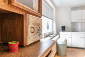 a kitchen with a counter top with a cup on it at Ferienwohnung Seestern in Wester-Ohrstedt +12 photos