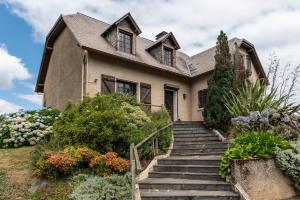 a house with stairs leading up to it at Villa Delb in Arthez-dʼAsson